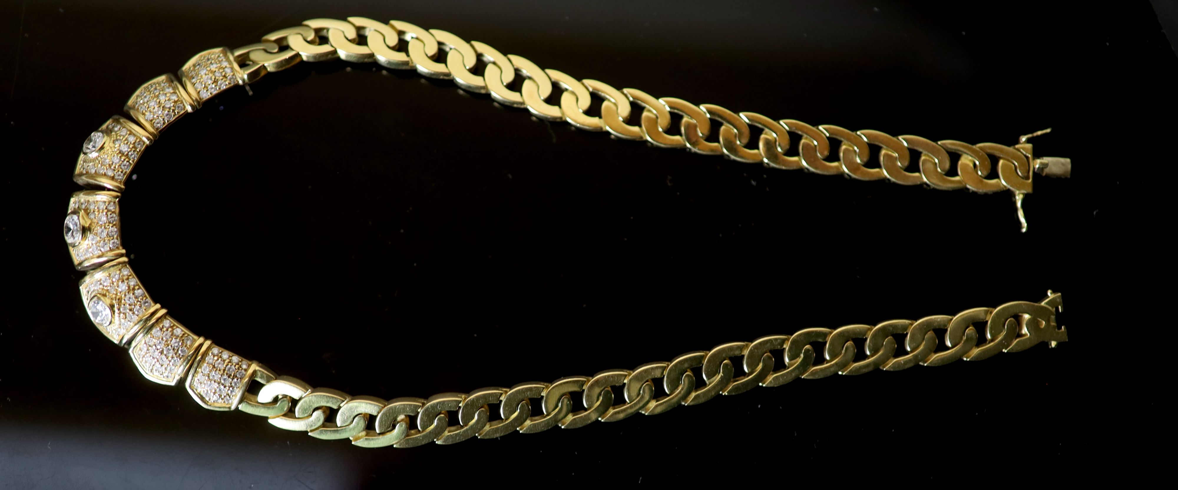 A modern Middle Eastern (possibly Egyptian) gold and diamond set oval curblink necklace,